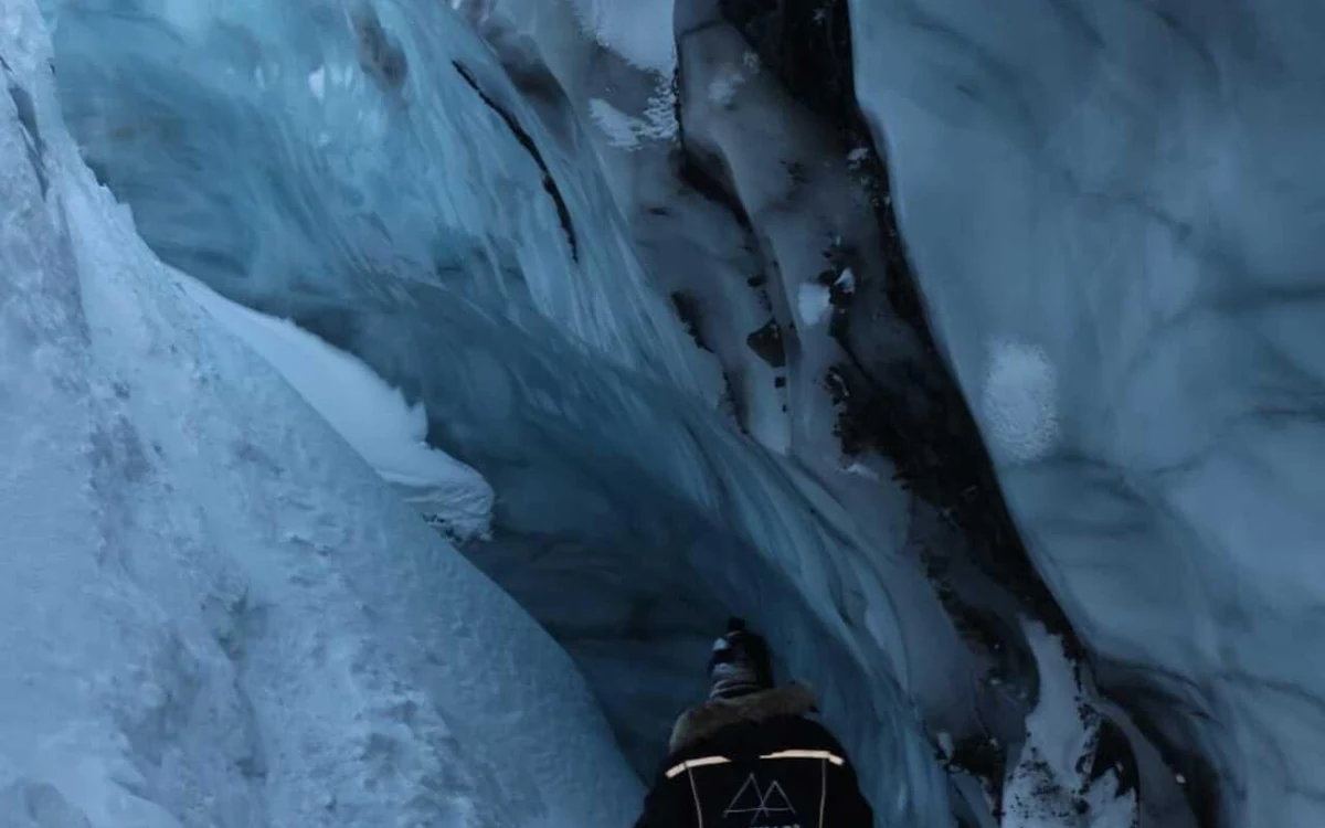 Blue ice walls inside a glacier cave on Svalbard